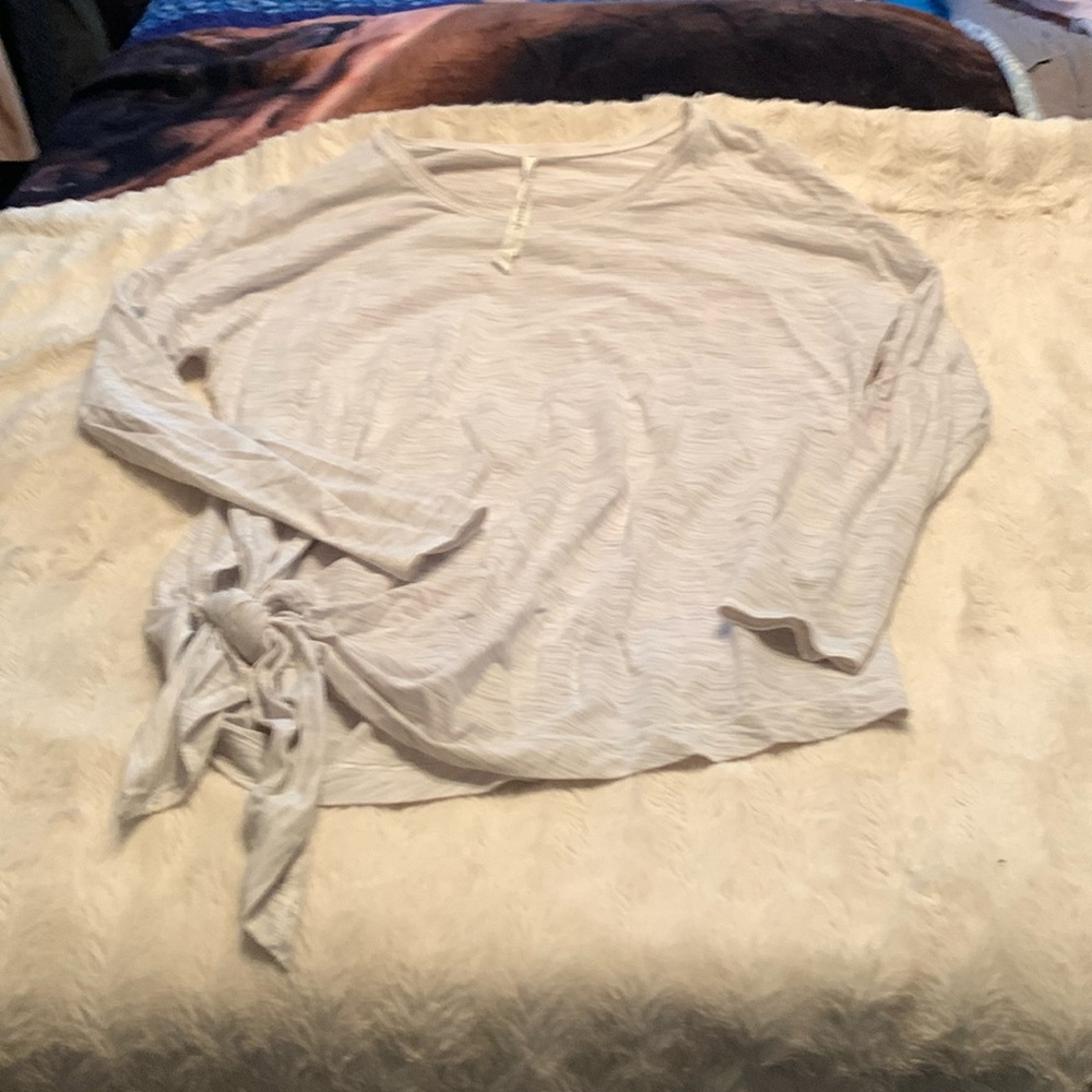 Size 12 Grey lululemon side tie work out top. Worn a lot but great condition.